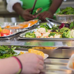 Selection of healthy foods in school cafeteria line